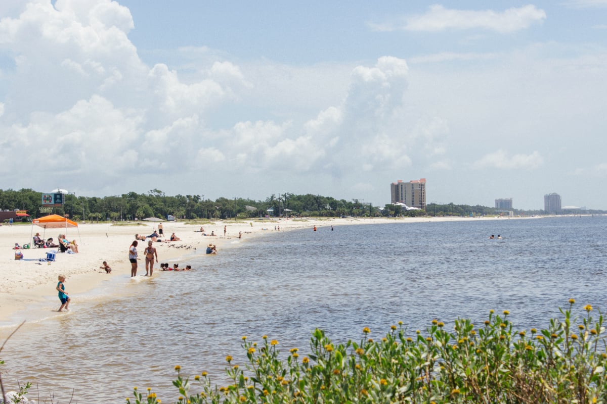 Beachgoers at Ken Combs Pier in Gulfport, MS